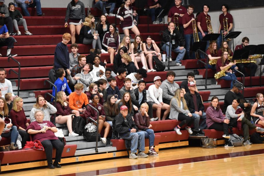 Edmond Memorial crowd watching a boys basketball game with an apparent lack of interest.