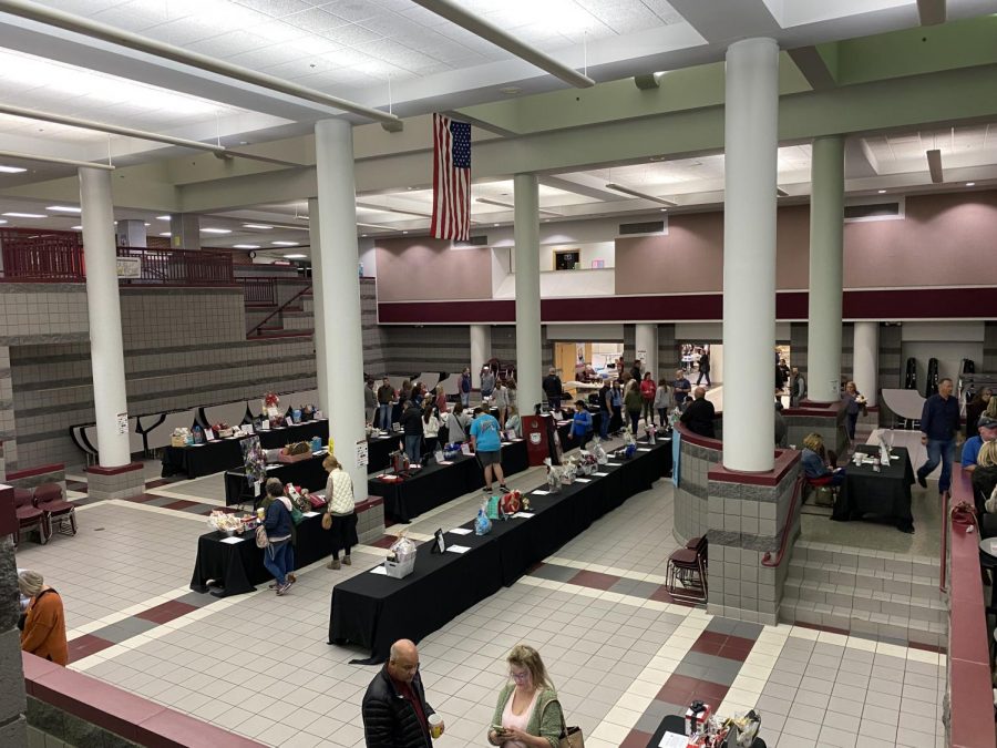 Members of the community bid on auction items at the Taste of Memorial.