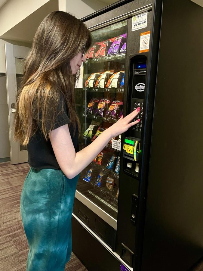 A Memorial student using the vending machine.