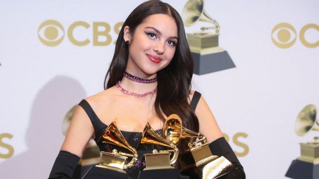 Olivia Rodrigo wins multiple awards at the Grammys with her pop album SOUR at the impressive age of 19. 