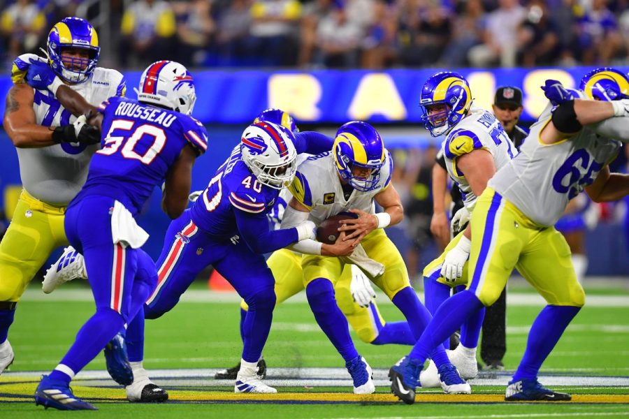 The Bills defense blitzes the Rams.
