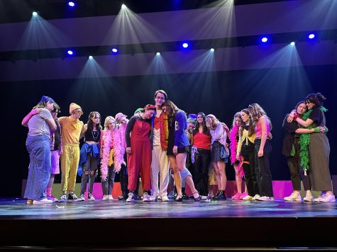 The cast of Godspell sharing a special moment during the show.