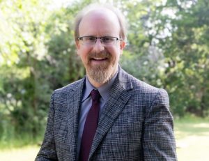 Edmond Memorial Principal Keith Pautler poses for his professional mugshot.