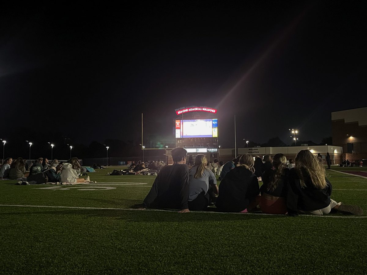 Students hanging out with friends during Scary Movie Night.