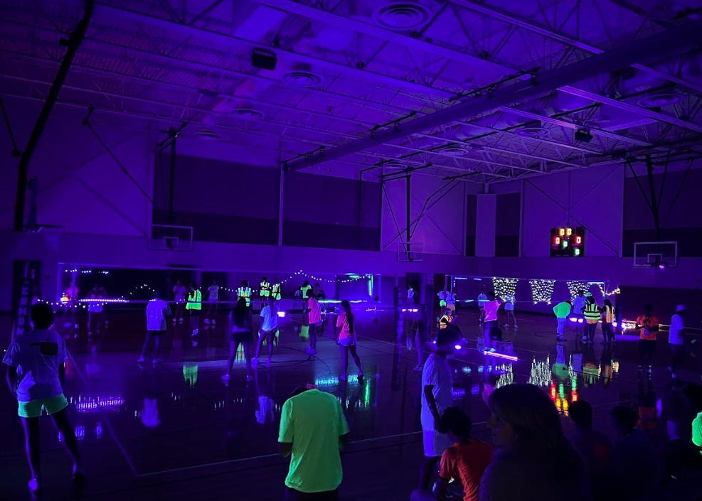 Edmond Memorial's east gym during the glow-in-the-dark volleyball event.