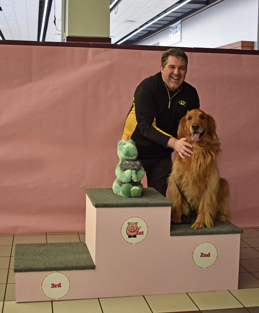 The overall dog show winner, Truman, poses with his prize.