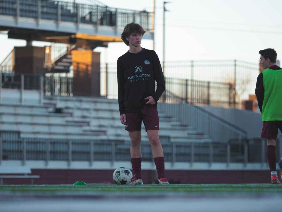 Eli Jacobson observes the opposing team, Oklahoma Christian School, before the game begins.