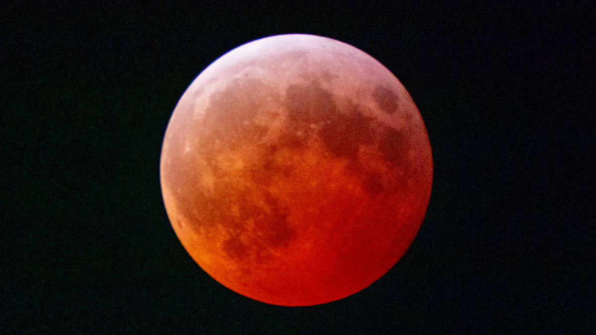 The total lunar eclipse of March 13, glowing red from the light coming from the sunsets and sunrises of Earth.