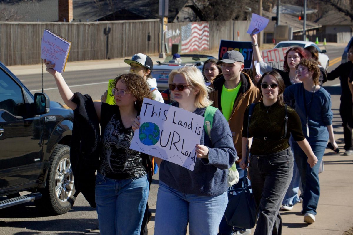 Protesters held up signs and chanted to pedestrians to spread their message.