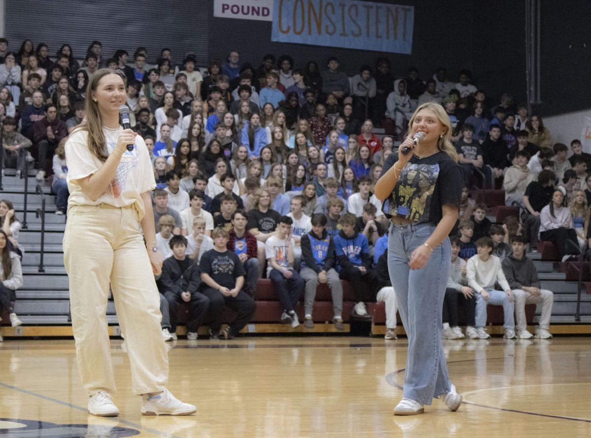 Swine Week chairs Karmen Wellington and Scout Killackey speak during the Swine Week kickoff assembly.