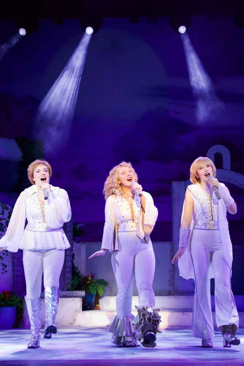 Donna and the Dynamos sing "Dancing Queen" and dance for the crowd.