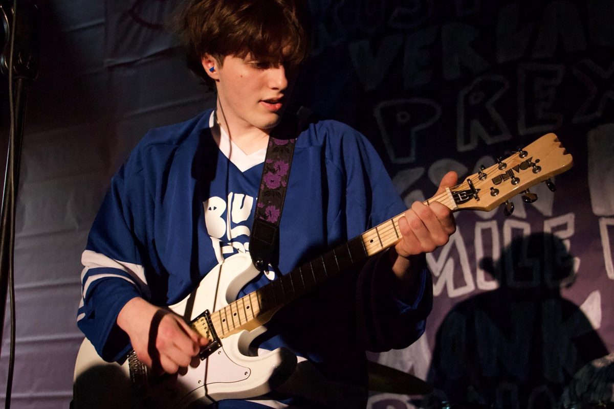 Arizona Dinger was the lead singer and rhythm guitarist in Blue Erie, who performed three original songs. 