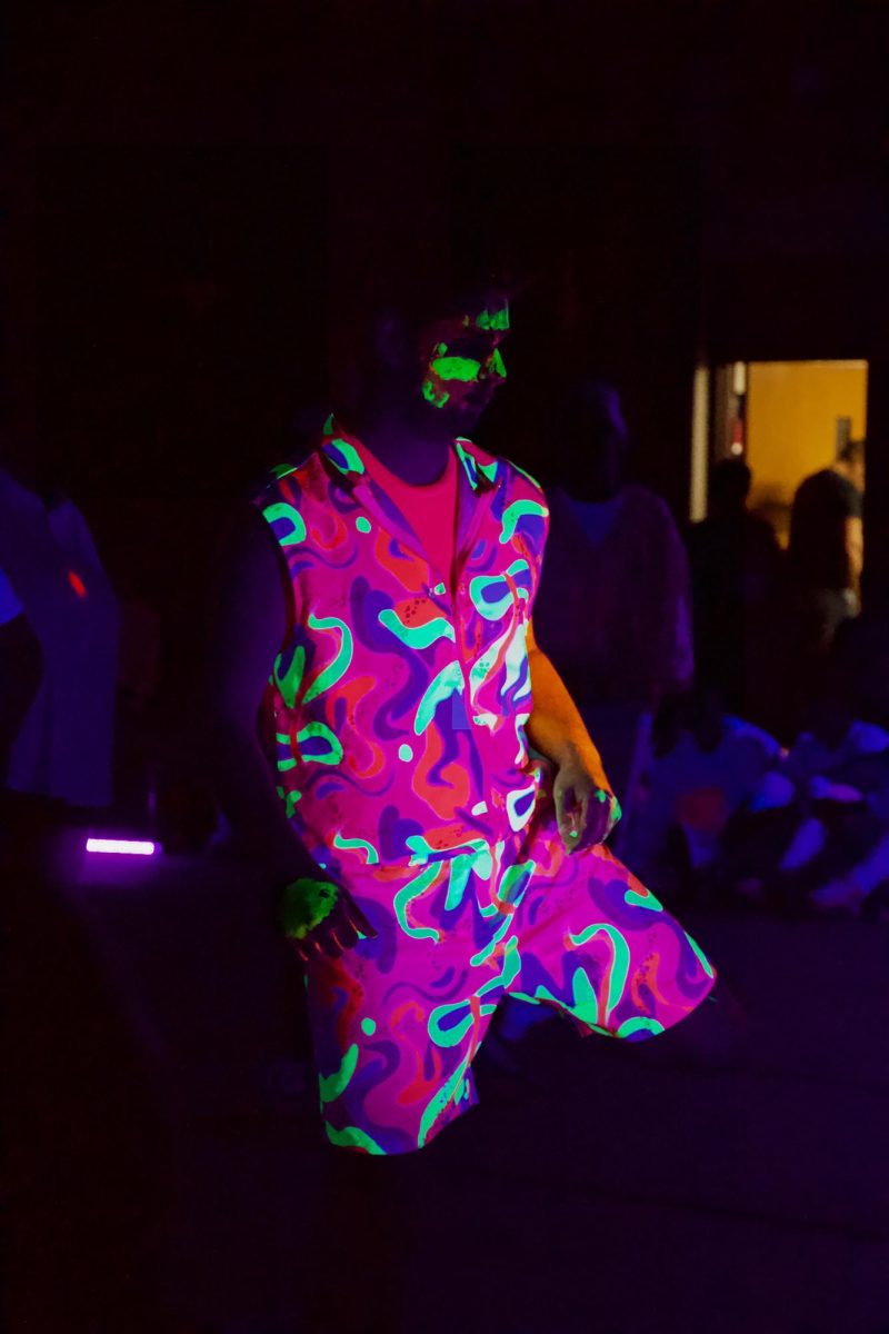 Lorenzo Lees, a special education student, wore a matching neon outfit for his performance.