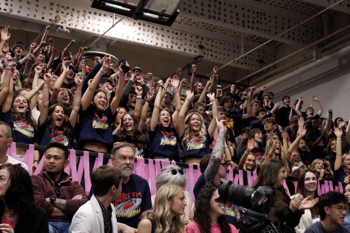 The juniors section of the at the assembly stands up and shout for the "Can You Dig It?"